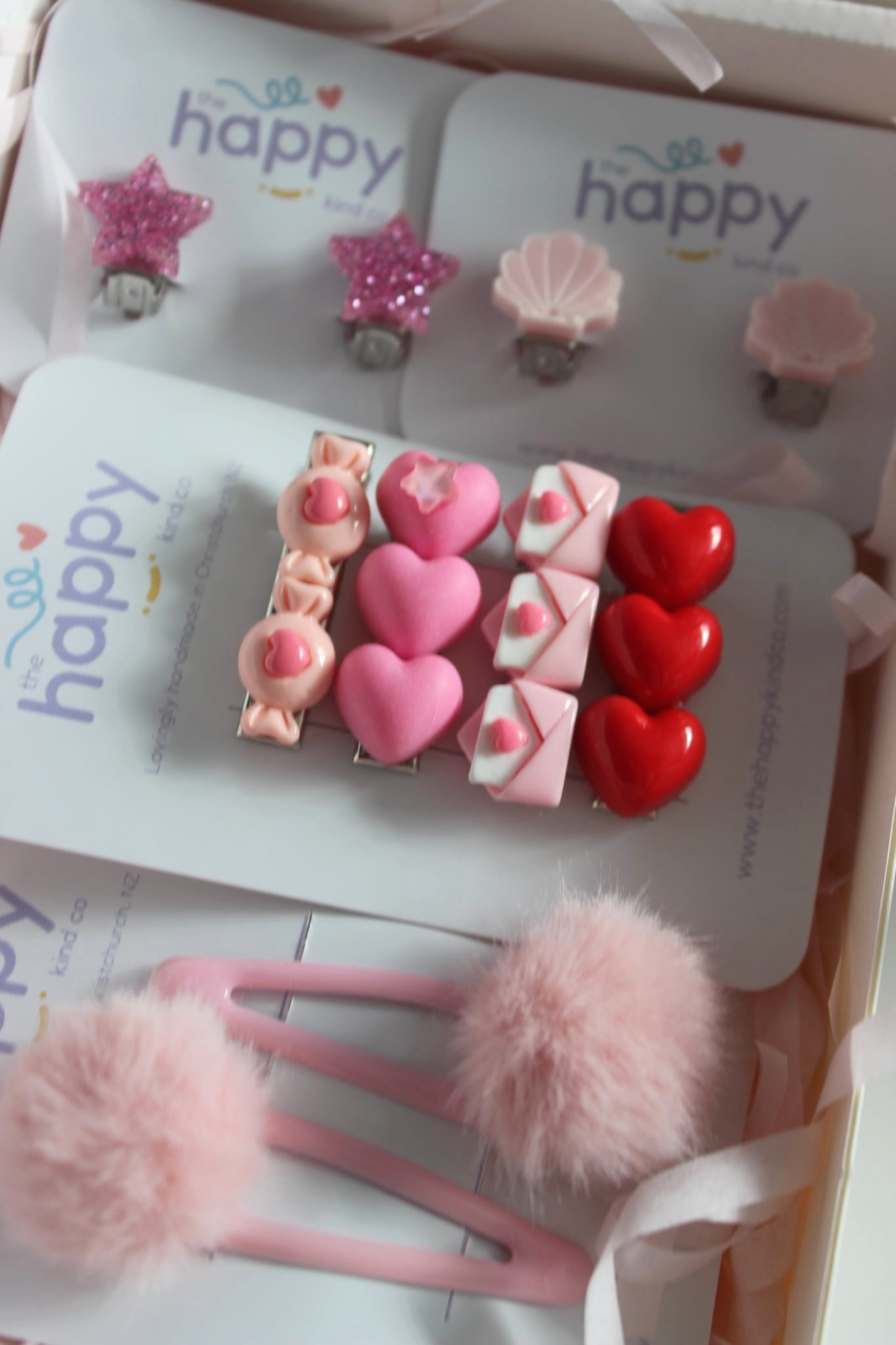 Blush Pom Pom Snap Clips